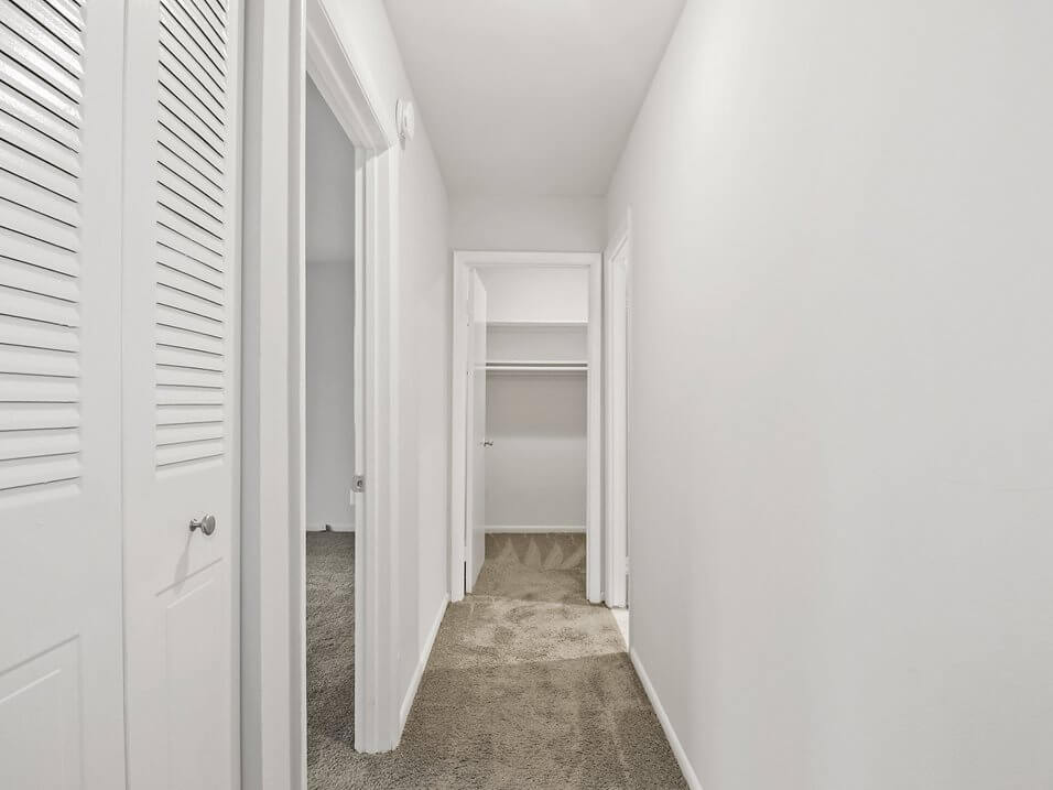 hallway with carpet floor