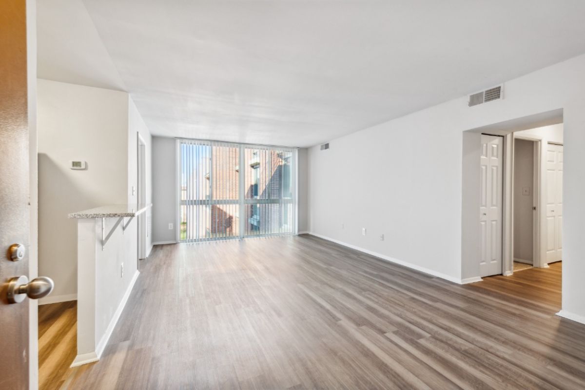 empty living space with floor to ceiling window